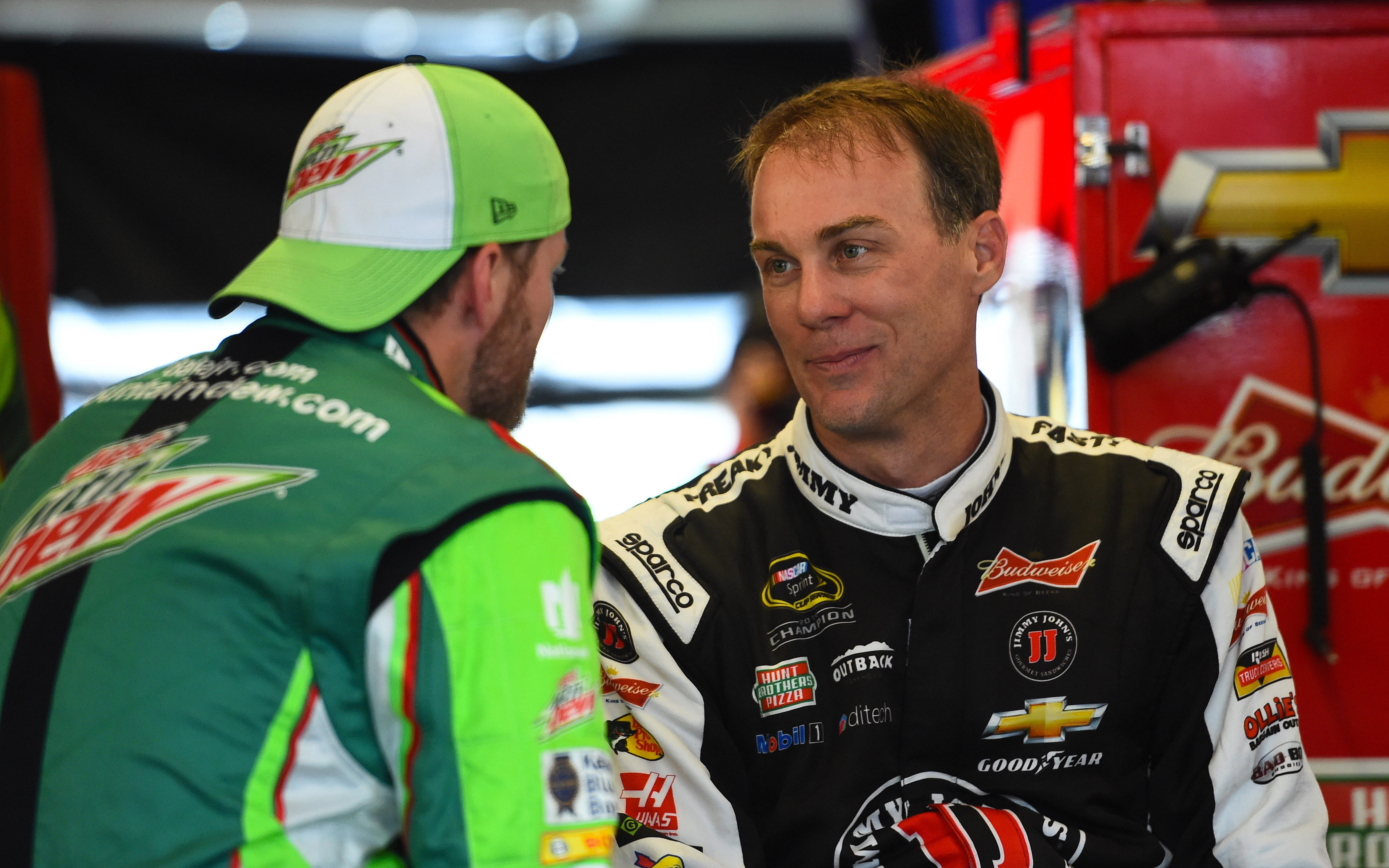 Dale Earnhardt, Jr. (L) and Kevin Harvick before the 2015 MyAFibStory.com 400 practice. Source: Imagn